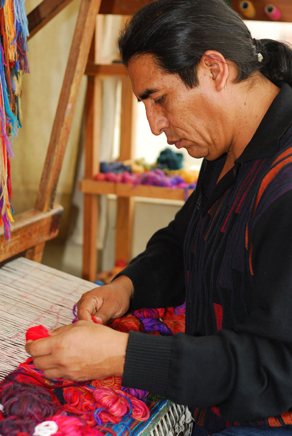 Maximo-Laura-weaving-on-the-loom